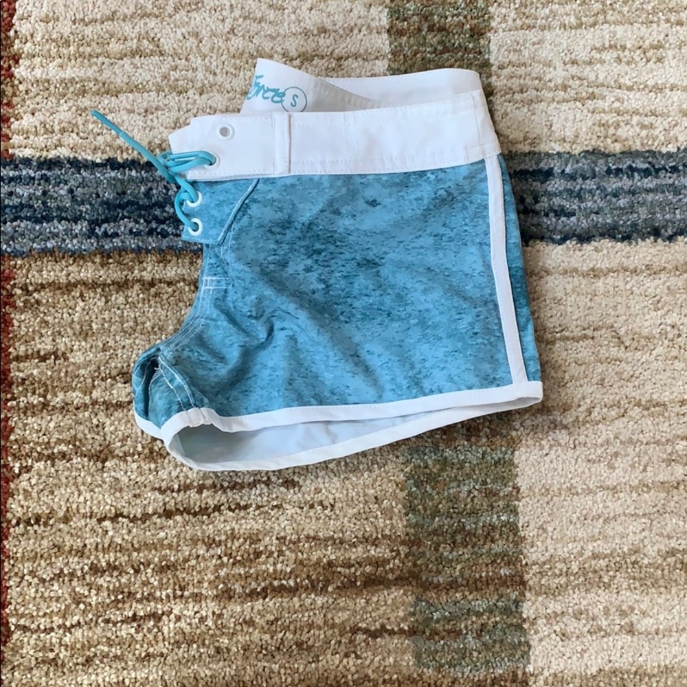white and blue used swim shorts